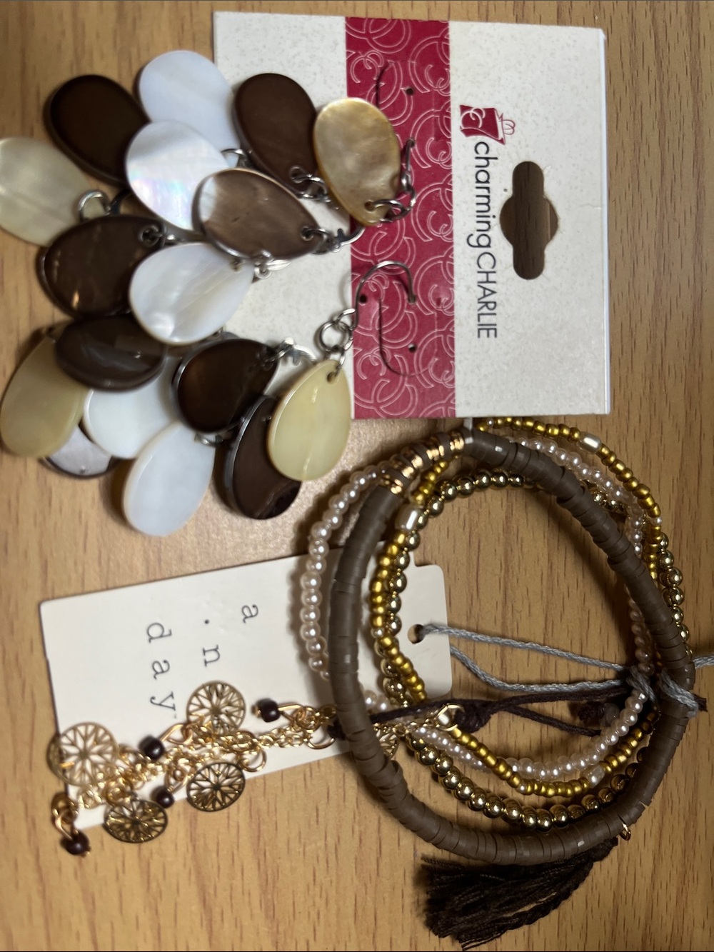 A New Day natural color mixed stackable bracelet and Charming Charlie earrings